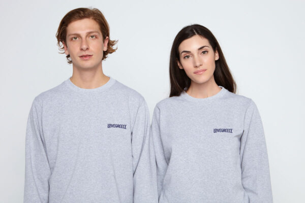 Couple wearing the same grey sweatshirts